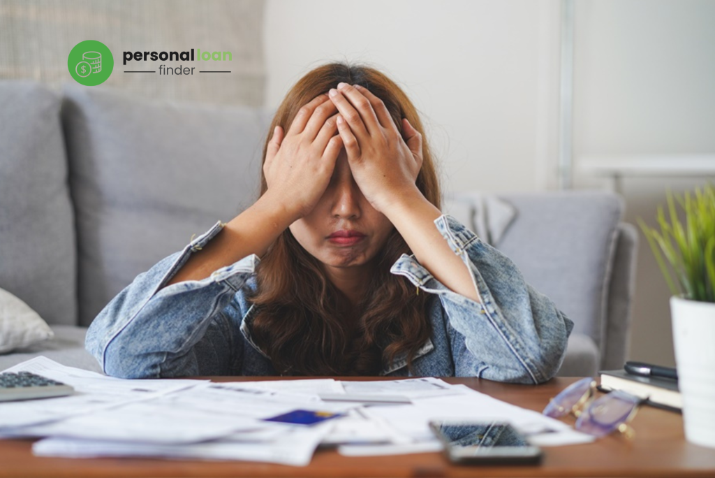 Young lady hiding her face due to financial stress, wondering if it’s possible to get a personal loan in Singapore with bad credit