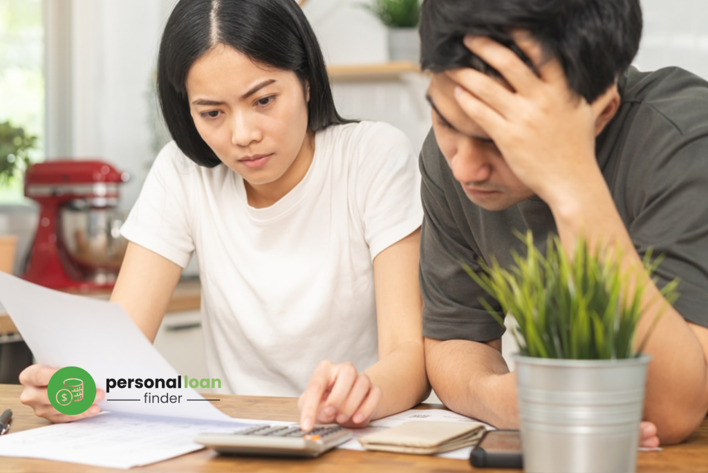 Stressed young couple calculating various debts, wondering if others can take a legal loan in Singapore on their behalf
