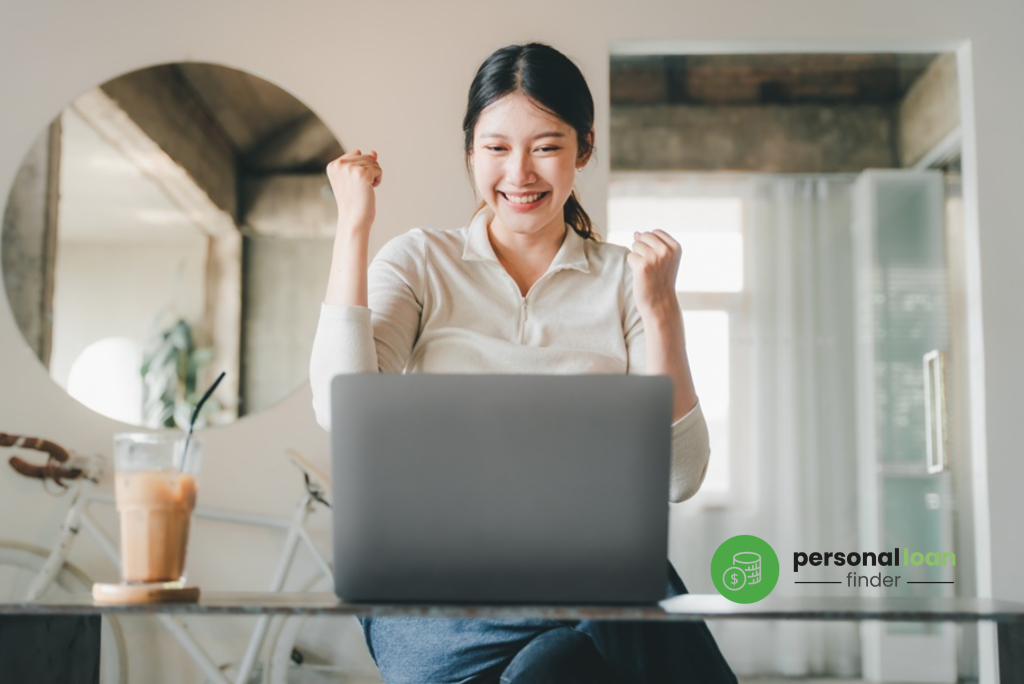 Excited woman learning simple tips online on how to get out of a personal loan within the personal loan repayment period