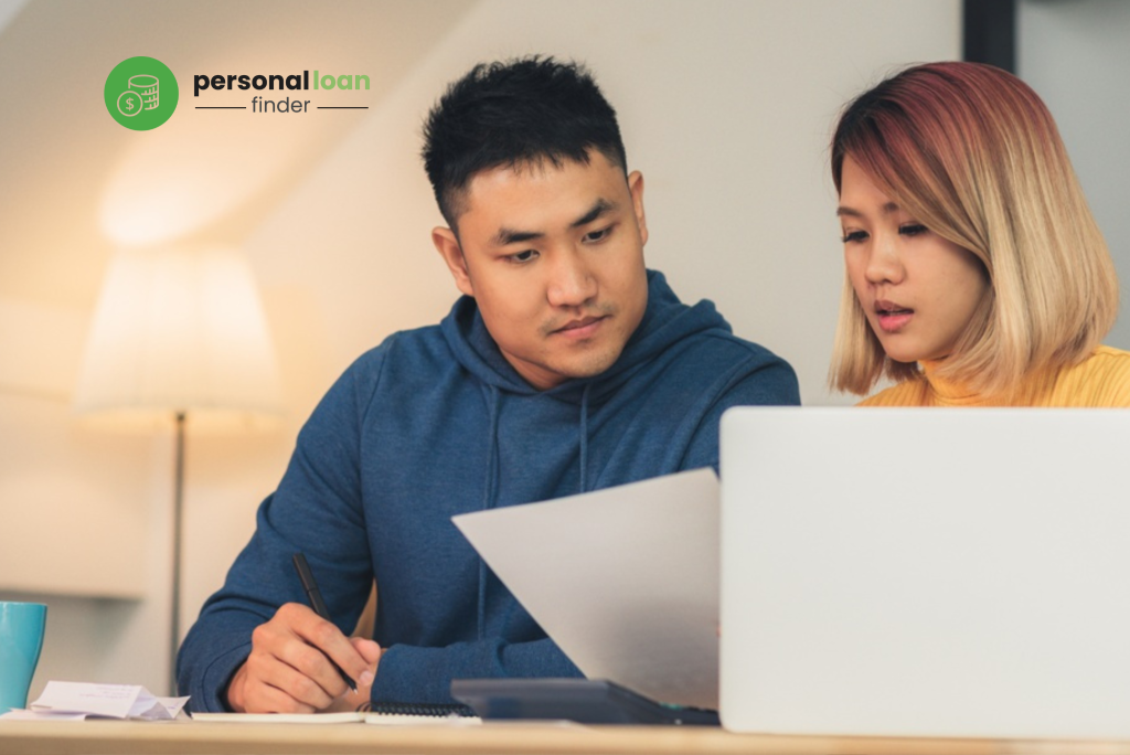 Young couple learning about pros and cons of debt consolidation loans and debt consolidation plans in Singapore