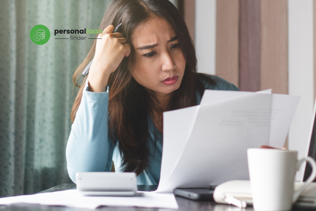 Woman in debt wondering if foreclosure charges on her personal loan is worth paying for or not